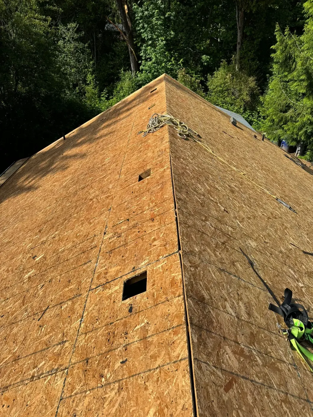 Hip roof stripped to bare decking during tear-off