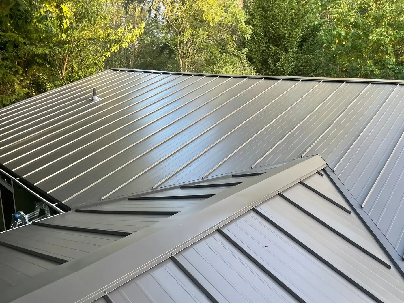 Metal roof over wooded lot - Standing-seam metal project in Greater Seattle area